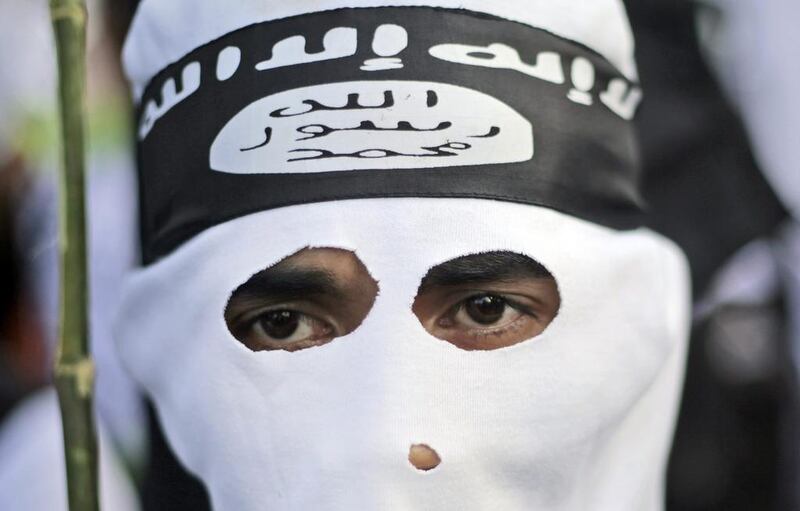 ISIL's logo is seen on the forehead of a protestor. Why are Europeans so attracted to its ideology, asks Faisal Al Yafai? (AP Photo/Dita Alangkara)