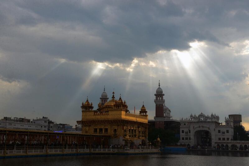 The Sikh Golden Temple is pictured under dark clouds in Amritsar, India. Narinder Nanu/AFP