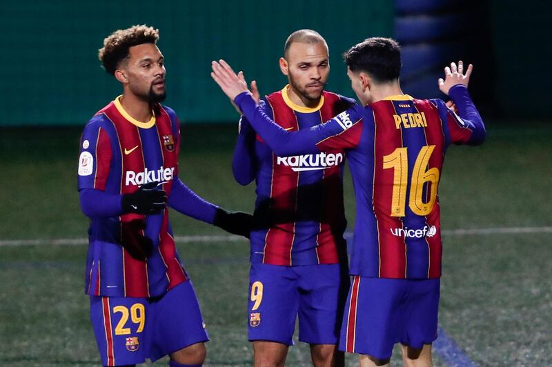Barcelona's Martin Braithwaite, centre, celebrates after scoring his side's second goal against Cornella in the Copa del Rey on Thursday, January 21. AP