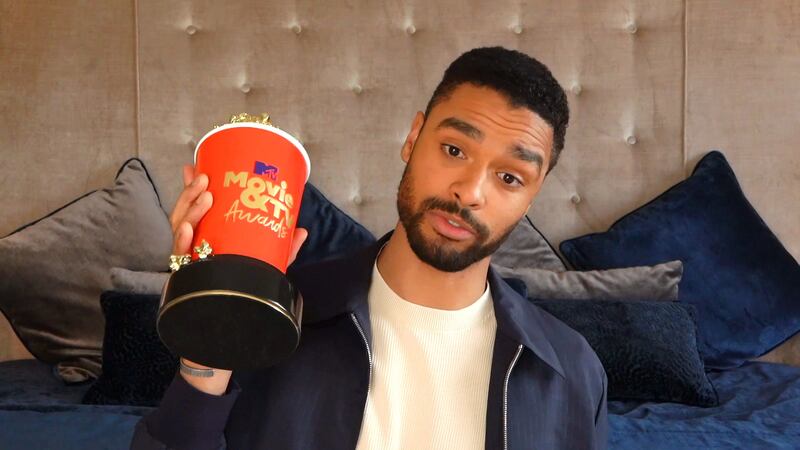 Rege-Jean Page holds his Breakthrough Performance award for 'Bridgerton' during the 2021 MTV Movie & TV Awards in Los Angeles, California on May 16, 2021. Reuters