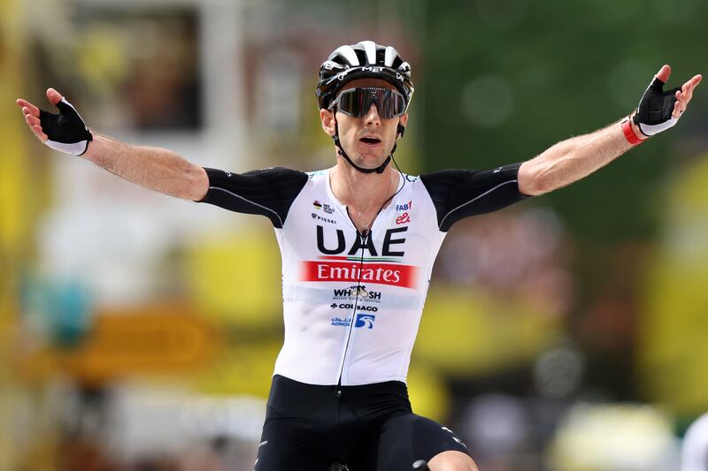 British rider Adam Yates, of team UAE Team Emirates, celebrates after winning Stage 1 of the Tour de France on July 1, 2023.   EPA