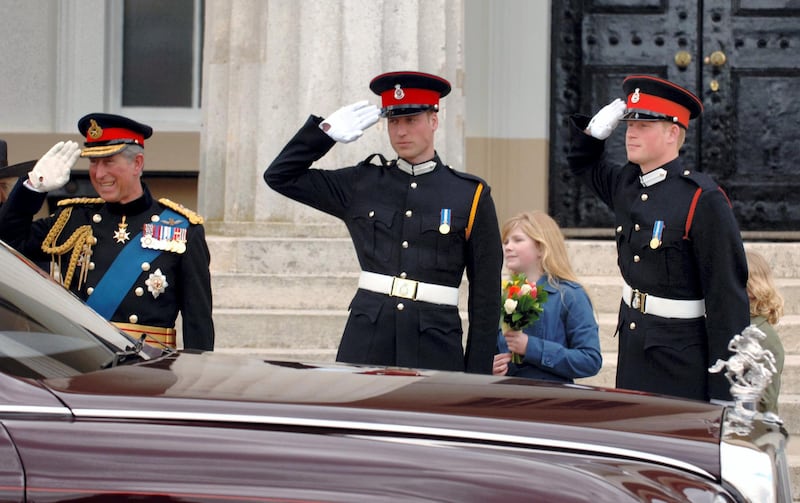 SANDHURST, ENGLAND - APRIL 12:  Prince Charles, Prince of Wales, Prince William and Prince Harry salute Queen Elizabeth II as she leaves the passing-out Sovereign's Parade at Sandhurst Military Academy on April 12, 2006 in Sandhurst, England. (Photo by Anwar Hussein/Getty Images)