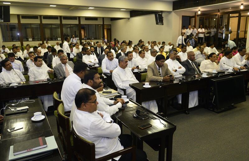 Sri Lankan MPs attend a meeting with parliament speaker Karu Jayasuriya.  AFP