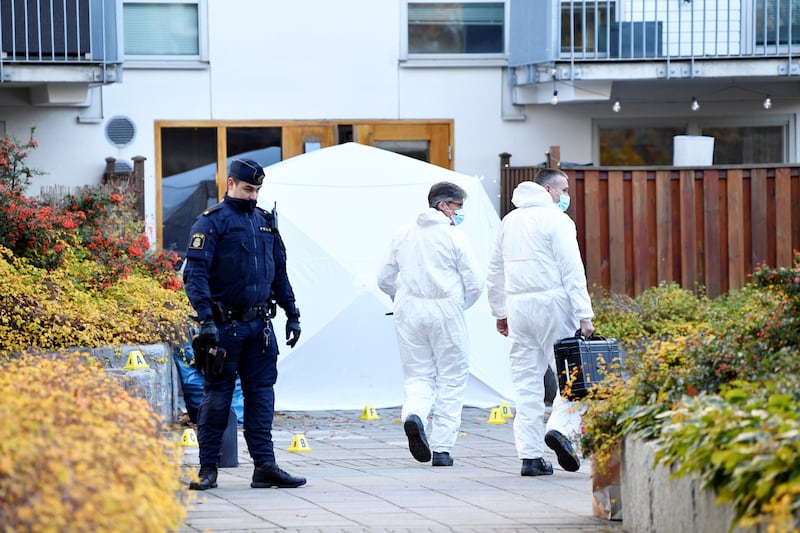 A police forensic team works at the scene in the Hammarby Sjostad district in Stockholm, where Swedish rap artist Einar was shot dead. EPA