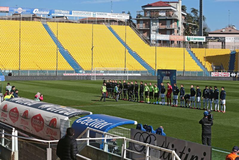 Parma and Spal players line up before game. EPA
