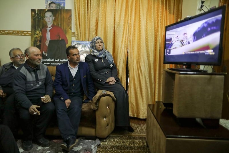 The parents and relatives of Palestinian Abdul Fatah Al Sharif watch the TV broadcast of the sentencing hearing of his killer, Israeli soldier Elor Azaria, in the West Bank City of Hebron February 21, 2017. REUTERS/Ammar Awad