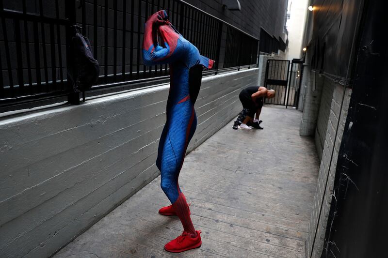 Two Spider-Man impersonators, Rashad Rouse, front, and Juan Carlos Banegas, an immigrant from Honduras, change in the alley next to the TCL Chinese Theatre after working on Hollywood Boulevard in Los Angeles. The boulevard is a place of diversity with a cast of superheroes from all over the world including Ukraine, England, Mexico, Germany and Nigeria. Jae C. Hong / AP Photo
