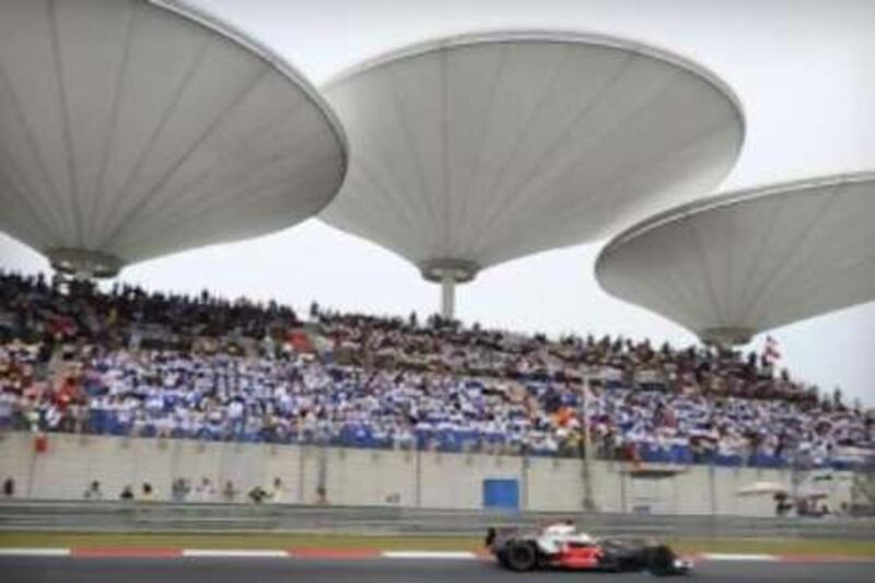 Lewis Hamilton of McLaren-Mercedes heads to victory in the F1 grand prix at the Shanghai International Circuit on Oct 19 2008. Shanghai is considering axing the loss-making Grand Prix after its contract runs out in 2010.