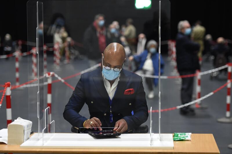 A member of staff wears a mask inside the Excel Centre in London. Getty Images