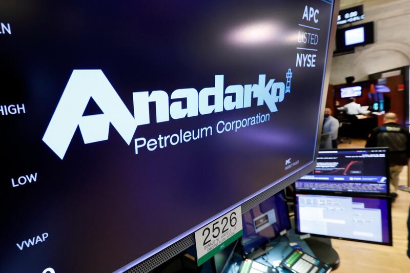 FILE - In this April 12, 2019, file photo the logo for Anadarko Petroleum Corp. appears above a trading post on the floor of the New York Stock Exchange. The overall slowdown in deals during the first quarter could be a prelude to a spike in deals for the rest of 2019. Several large deals have already been announced in the second quarter. Chevron is buying Anadarko Petroleum for $33 billion. (AP Photo/Richard Drew, File)