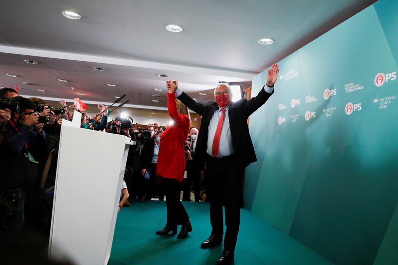 Antonio Costa celebrates with his wife Fernanda Tadeu after the Socialists won the general election in Lisbon on January 31, 2022.  Reuters