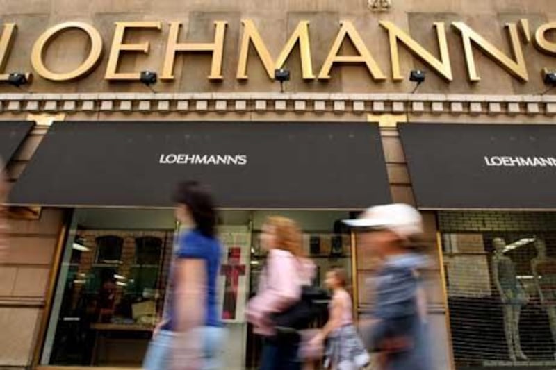 Pedestrians walk past Loehmann's department store in the Chelsea neighborhood of New York, U.S., on Tuesday, April 6, 2010. Suppliers to the clothing retailer have begun to stop shipments due to the store's deteriorating finances, the New York Post reported. Photographer: Jin Lee/Bloomberg 


