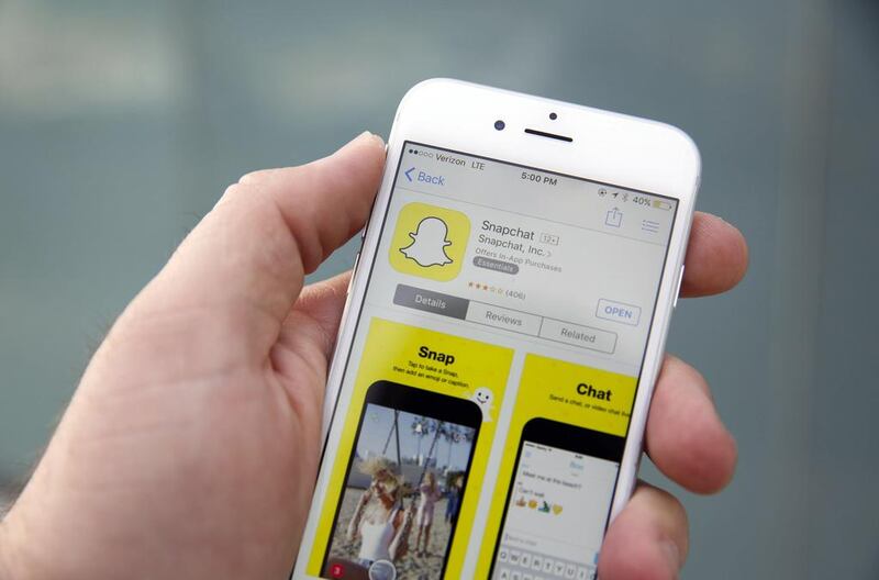 The Snapchat app has fallen foul of telecoms regulations in the UAE but it has many fans. Patrick T Fallon / Bloomberg