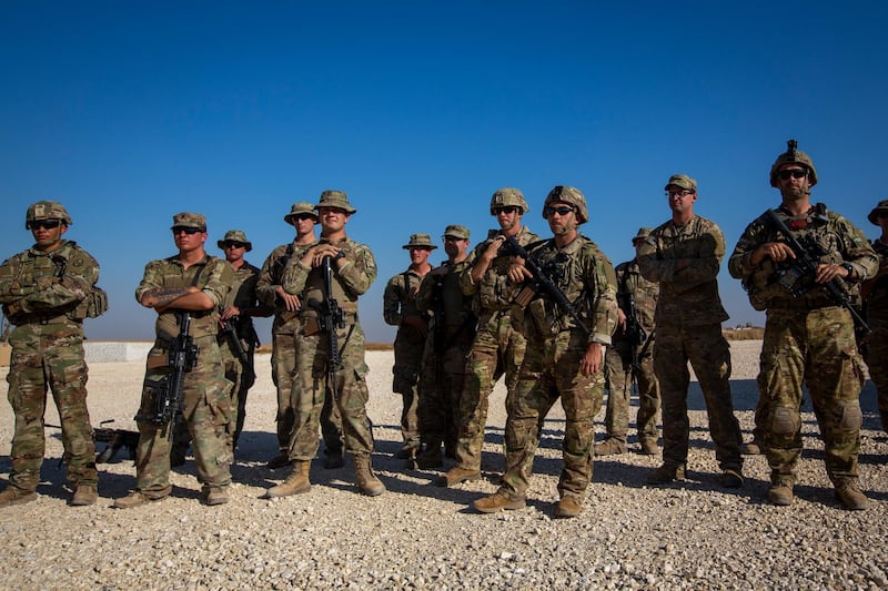 Crew of Bradley fighting vehicles stand at a US military base in north-eastern Syria on November 11, 2019. AP Photo