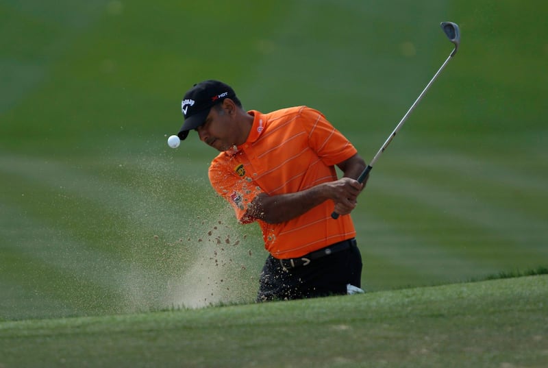 Jeev Milkha Singh of India hits out of a bunker at the first green during the fourth and final round of the Dubai Desert Classic at the Emirates Golf Club, February 3, 2013. REUTERS/Jumana El Heloueh (UNITED ARAB EMIRATES - Tags: SPORT GOLF) *** Local Caption ***  DUB07_GOLF-EUROPEAN_0203_11.JPG