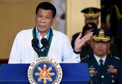 FILE PHOTO: Philippines President Rodrigo Duterte gestures during an armed forces change of command ceremony at Camp Aguinaldo in Quezon City, Metro Manila, Philippines April 18, 2018. REUTERS/Dondi Tawatao/File Photo