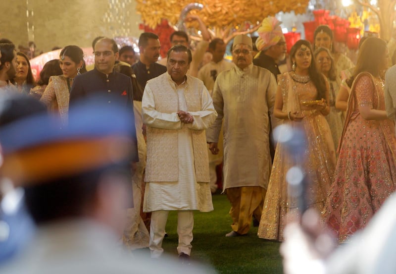 Mukesh Ambani, who is the chariman of Reliance Industries, waits for the arrival of the groom. AP Photo