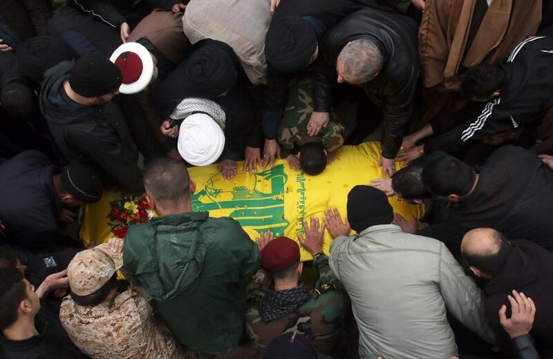 Mourners attend the funeral in Jibshit, Lebanon, of Ali Ahmed Sabra, a member of Hizbollah who was killed alongside Syrian government forces in Aleppo, on February 6. Mahmoud Zayyat / AFP