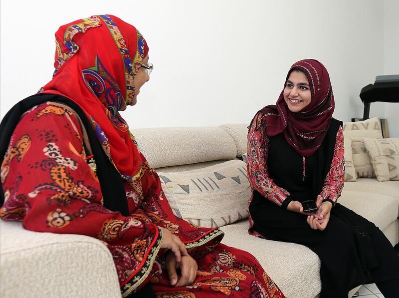 ( L ) Dr Nusrat Irshad speaks with her daugher Ayesha Memon who will be awarded soon for the full marks in mathematics talks to her mother Dr Nusrat Irshad at her residence in Fujairah. Satish Kumar / The National 