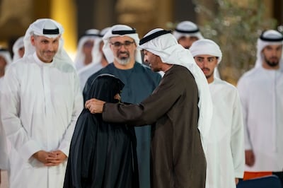President Sheikh Mohamed presents an Abu Dhabi Award to Amna Al Qemzi. UAE Presidential Court