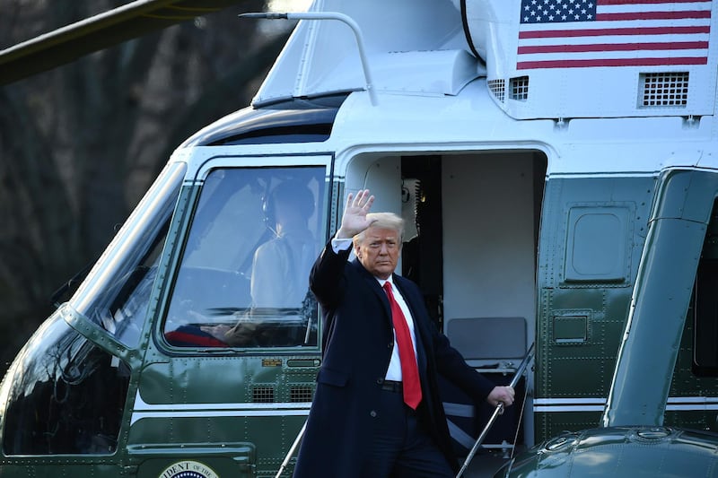Outgoing US President Donald Trump waves as he boards Marine One at the White House in Washington. AFP