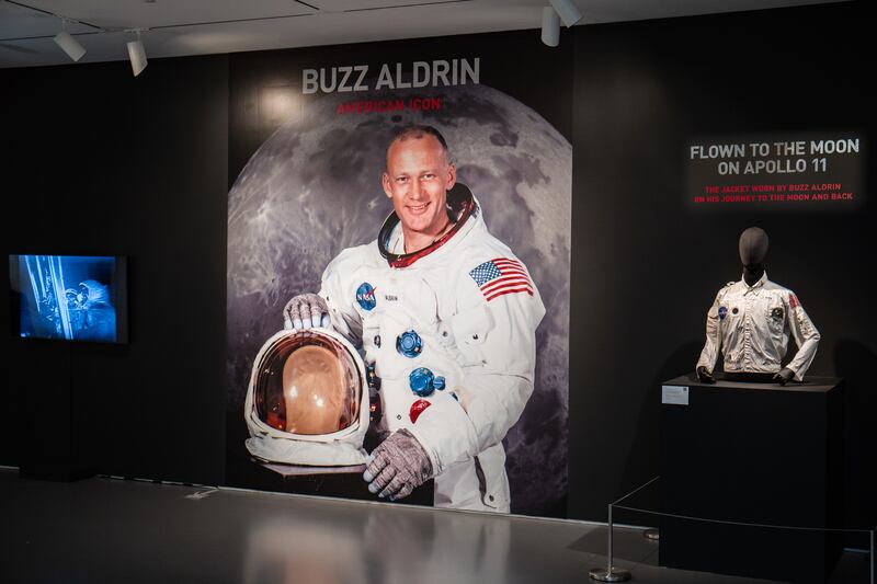 The jacket is displayed next to a photo of Buzz Aldrin, who is  wearing it under his space suit. Photo: Sotheby's