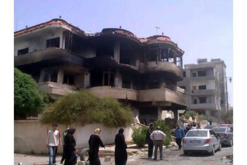 A burnt-out building in the southern city of Daraa, Syria, where the army last week shelled residential areas and unleashed security forces in an intensified push to crush the uprising against President Bashar al Assad, killing an 8-year-old boy and at least 17 others, a human rights group said.