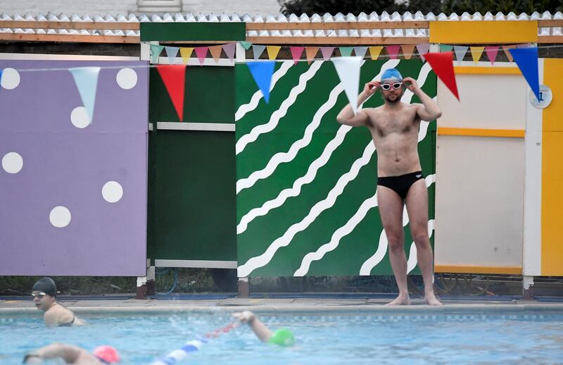 Swimmers enjoy Hampton Lido in London on the first day of the easing of lockdown restrictions. Reuters