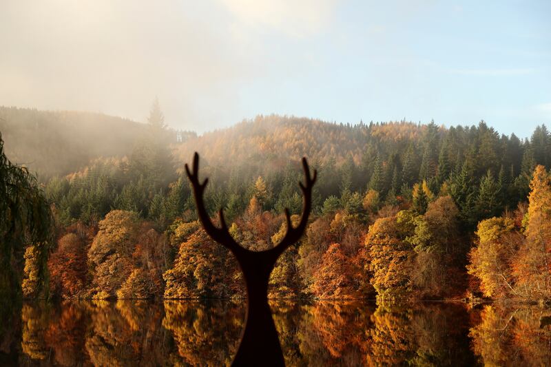 A deer statue in silhouette on Tuesday morning at Loch Faskally in Pitlochry, Scotland. Reuters