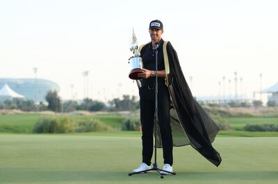 Victor Perez of France on the 18th green after being presented with the trophy. Getty