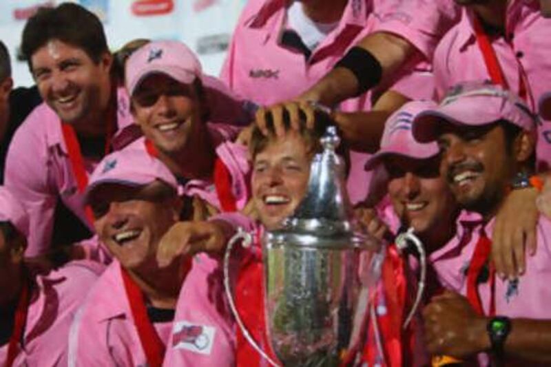 The Middlesex captain Ed Joyce (centre) poses with the Twenty20 trophy after the final with Kent.