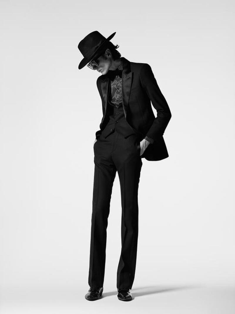 A Bowie-inspired silhouette, with an unmistakable wide-brimmed hat and aviator shades. Courtesy Saint Laurent