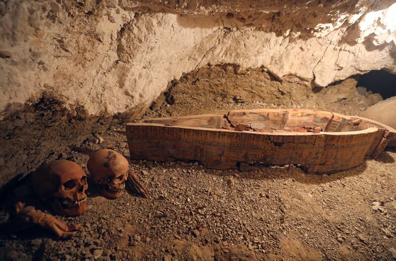 Skulls and hands are seen next to a coffin in the recently discovered tomb of Amenemhat in Egypt. Mohamed Abd El Ghany / Reuters
