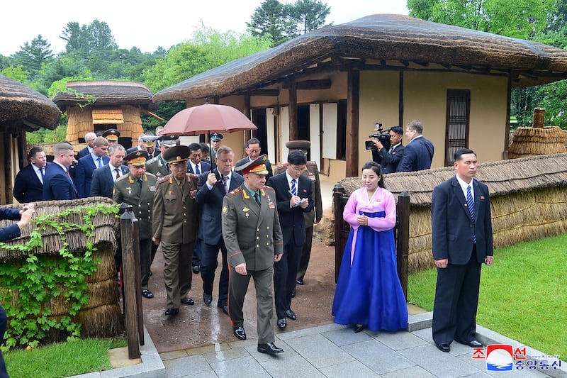 Mr Shoigu and members of the Russian military delegation visit Mangyongdae. Reuters