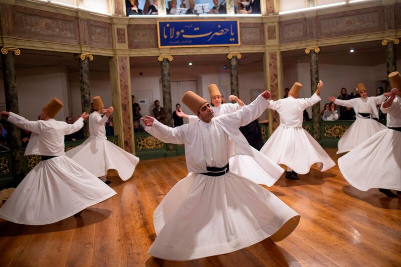 Whirling dervishes perform during a ceremony marking the anniversary of the death of Jelaleddin Mevlana Rumi, Sufi mystic, poet and founder of the sufism at Galata Mevlihanesi in Istanbul. AFP