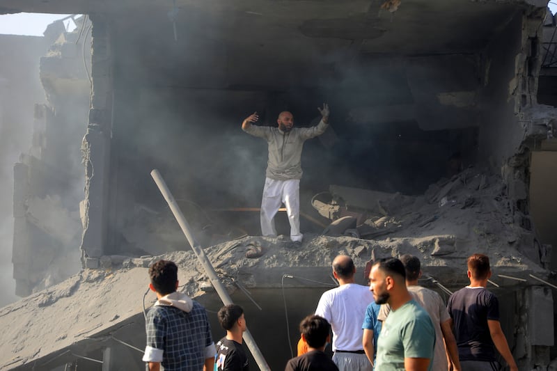 Palestinians look for survivors among the rubble of destroyed buildings following Israeli strikes on Jabalia refugee camp in northern Gaza. AP