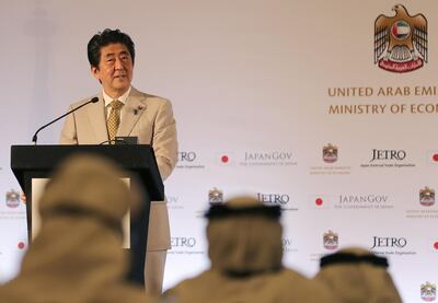 Japan's Prime Minister Shinzo Abe speaks during a Japan-UAE Business Forum in Abu Dhabi on April 30, 2018. / AFP PHOTO / KARIM SAHIB