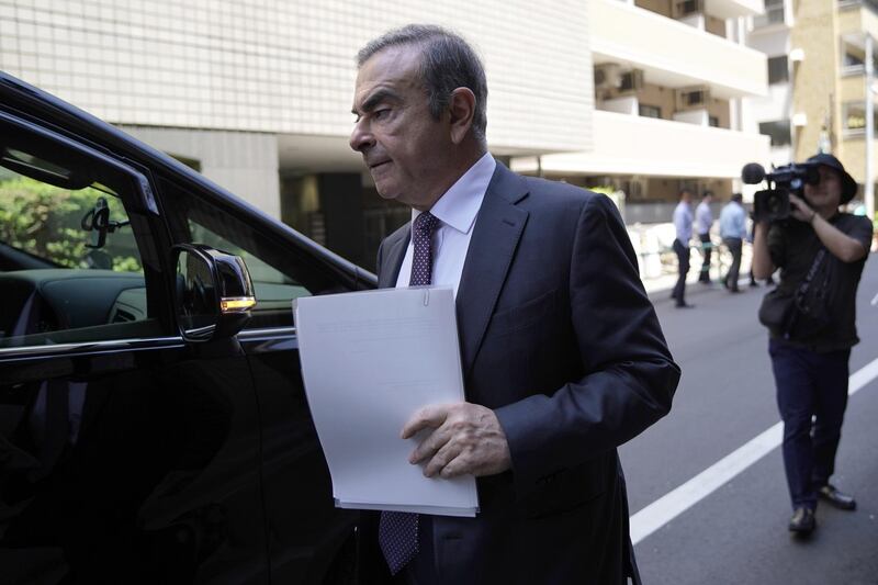 Carlos Ghosn, former chairman of Nissan Motor Co., walks towards a vehicle as he leaves his lawyer's office in Tokyo, Japan, on Thursday, May 23, 2019. Pre-trial hearings for Ghosn began Thursday at the Tokyo District Court's 17th Criminal Court Division, kicking off a new phase in a saga that began in November when Ghosn was arrested just after landing at Haneda Airport on a private jet. Photographer: Toru Hanai/Bloomberg