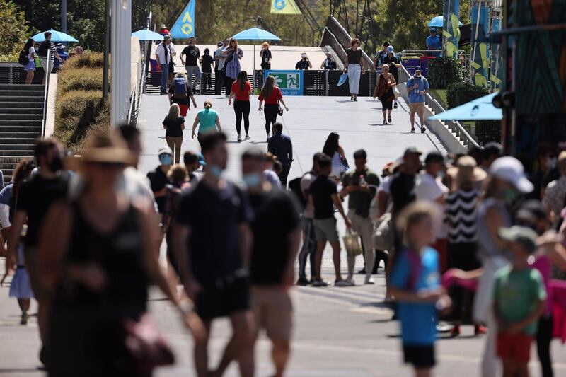 Fans walk to matches on day five of the Australian Open. AFP