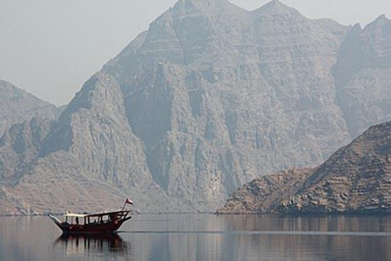 The rugged coastline of Musandam, Oman. Biosphere Expeditions is conducting diving conservation holidays to map out and study the marine life and coral in the waters off the peninsula.