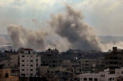 Smoke rises from an Israeli missile strike on a target in Gaza City,Tuesday, Dec. 30, 2008. Israeli aircraft kept up a relentless string of assaults on Hamas-ruled Gaza on Tuesday, smashing a government complex, security installations and the home of a top militant commander as thousands of Israeli ground troops, backed by tanks and artillery, massed along the border, waiting for a signal to attack. (AP Photo/Khalil Hamra) *** Local Caption ***  JRL132_MIDEAST_ISRAEL_PALESTINIANS.jpg