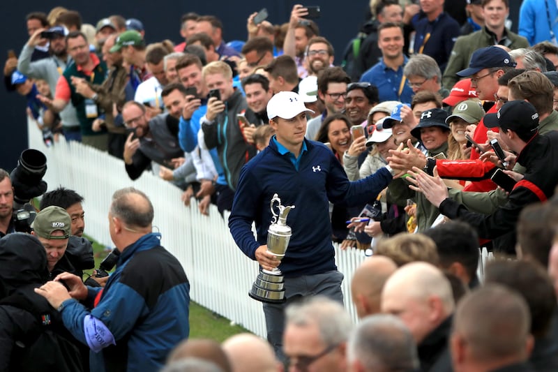 Jordan Spieth of the United States celebrates victory as he walks with the Claret Jug around the 18th green during the final round of the 146th Open Championship at Royal Birkdale on July 23, 2017 in Southport, England. Andrew Redington / Getty Images