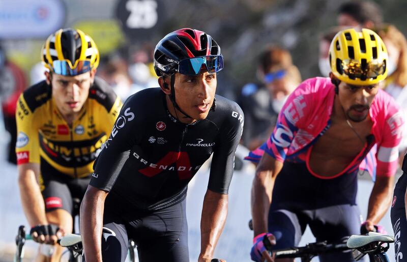 epa08666905 Colombian rider Egan Bernal (C) of the Ineos Grenadiers team crosses the finish line of the 15th stage of the Tour de France over 174.5km from Lyon to Grand Colombier, France, 13 September 2020.  EPA/Thibault Camus / Pool