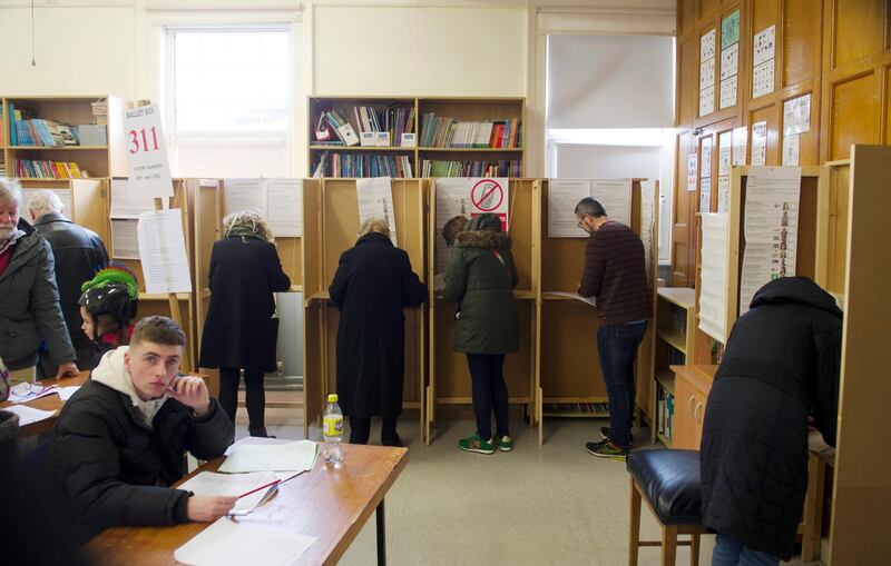 Irish people vote in general elections at a polling station in Dublin, Ireland.  EPA