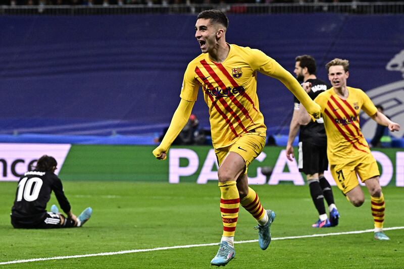 Ferran Torres runs off in celebration after scoring against Real Madrid. AFP