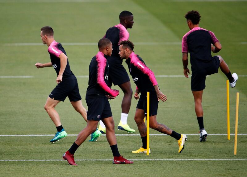 Neymar and Mbappe with teammates during training. Reuters