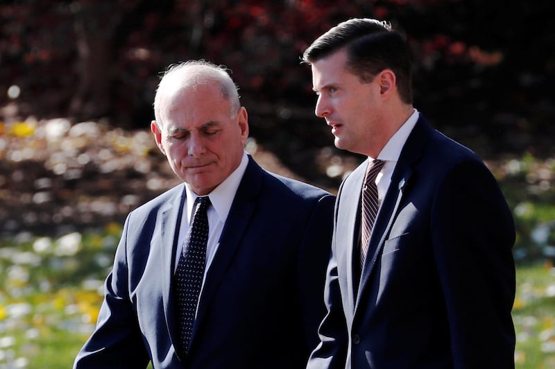 White House Chief of Staff John Kelly walks with White House Staff Secretary Rob Porter to depart with U.S. President Donald Trump aboard the Marine One helicopter from the White House in Washington, U.S. November 29, 2017. Picture taken November 29, 2017. REUTERS/Jonathan Ernst