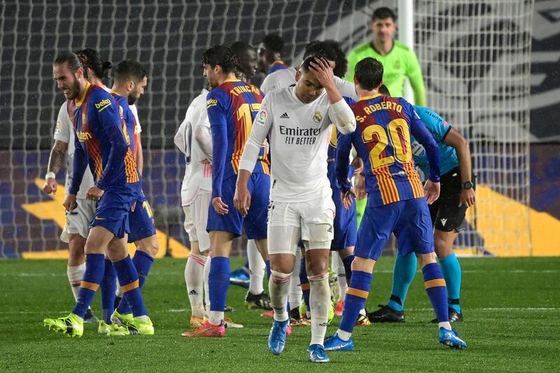 Real Madrid's Brazilian midfielder Casemiro reacts after receiving a red card during the "El Clasico" Spanish League football match between Real Madrid CF and FC Barcelona at the Alfredo di Stefano stadium in Valdebebas, on the outskirts of Madrid on April 10, 2021. / AFP / JAVIER SORIANO

