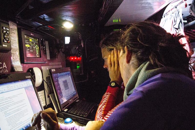Carolijn Brouwer, right, of Team SCA studies the weather map as they cross the Atlantic Ocean from Lanzarote Spain to Newport Rhode Island last month during training for the Volvo Ocean Race which begins later this year. Organisers hope the technology used for this year’s race will humanise the experience for those following onshore. Corinna Halloran / Getty Images