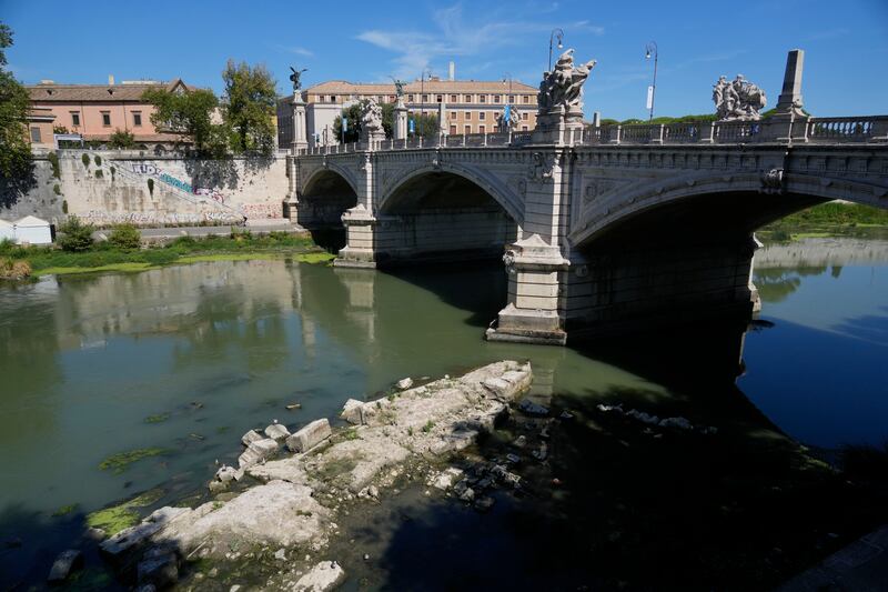 The exposed ruins of Nero’s Bridge, next to the Vittorio Emanuele bridge in Rome. AP